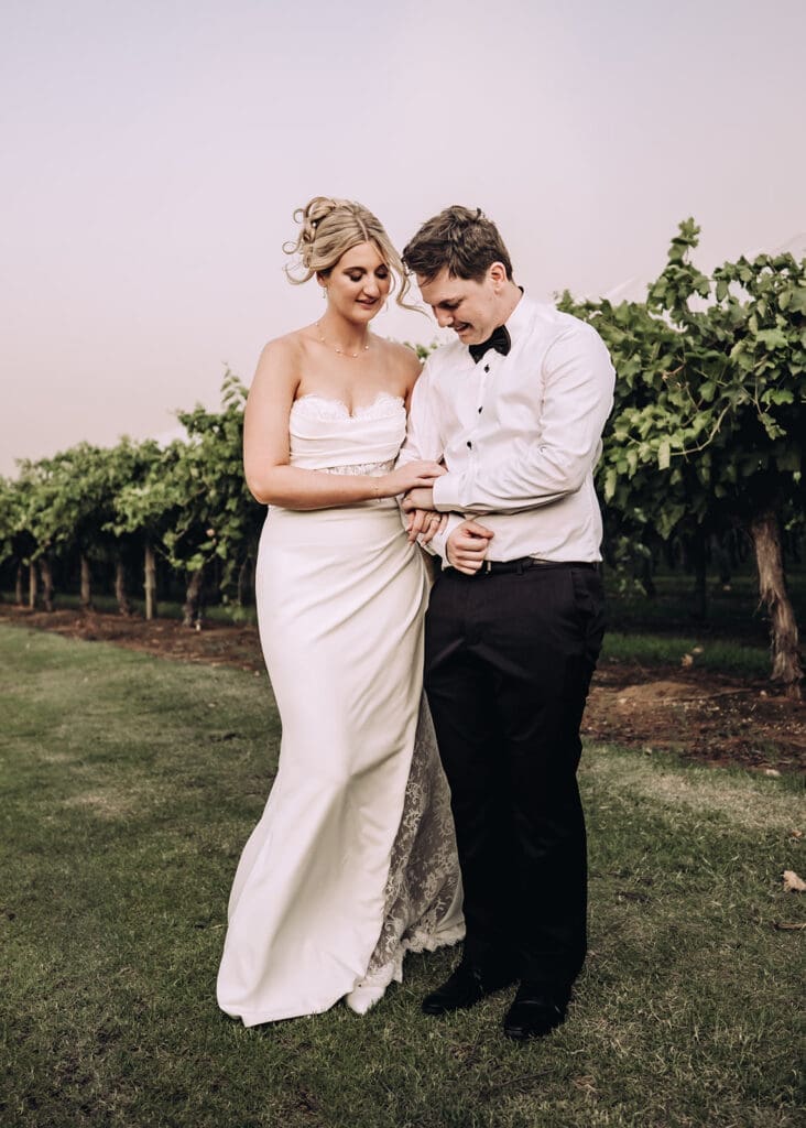 Bride and groom spending time outside during portraits at Willow and Ivie wedding venue Mildura, photographed by Miss Moody Photography