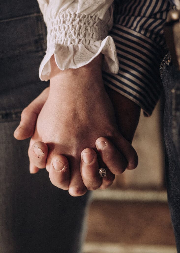 Couple holding hands during engagement session in Donald Victoria